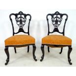 A pair of Victorian mahogany salon chairs,