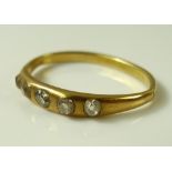 A 14ct gold ring set with five old cut diamonds, approx 0.