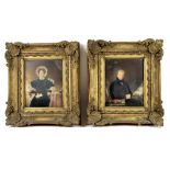 A pair of Regency portraits depicting a vicar and his wife, he resting upon a bible,