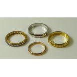 A collection of gold rings, comprising an 18ct gold ring engraved with daisies, size N, 3.