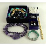 A large quantity of costume jewellery including hat pins, a lilac quartz necklace,