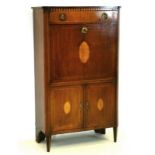 An early 19th century mahogany secretaire cabinet, marquetry inlaying to doors,