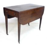 A Regency mahogany Pembroke table, the rectangular surface with drop leaves,