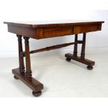 An early Victorian mahogany desk, two frieze drawers, turned column supports and stretcher,