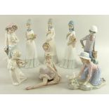 A group of ceramic figurines, comprising a Lladro figurine modelled as a seated ballet dancer,