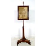 A William IV rosewood pole screen, with tri-partite mahogany base,