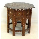 A 19th century bone inlaid Moorish or Indian octagonal occasional table, with separate folding base,