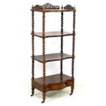 A late Victorian mahogany whatnot, with four tiers, pierced and fret carved three quarter gallery,