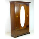 An Edwardian mahogany gentleman's wardrobe,