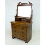 An Art Nouveau oak dressing chest, with rectangular mirror plate, two trinket drawers,