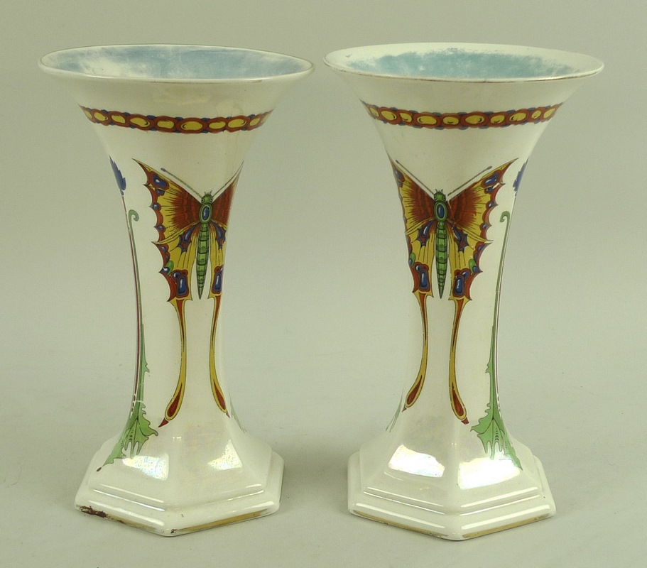 A pair of Crown Ducal Art Nouveau lustre vases, each decorated with vibrant red,