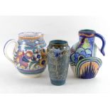 A group of hand painted pottery, comprising a Poole Pottery ovoid form jug,