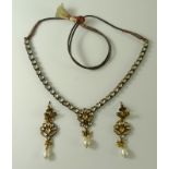 And Indian kundan crystal necklace and matching earrings,