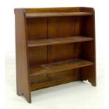 A small early 20th century mahogany bookshelf, with three graduating fixed shelves, two plank back,