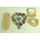 A large quantity of costume jewellery, including glass beads, a Murano style glass cross pendant,