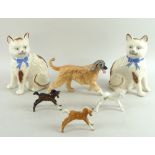 A group of ceramic figurines, comprising a Beswick figure modelled as a running Afghan hound,