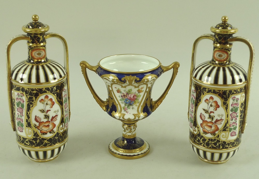 A group of china, comprising a Royal Crown Derby vase with two handles,