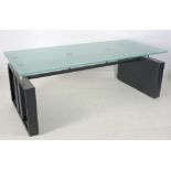 A modern design glass topped dining table, circa 2000,