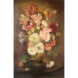 A large Dutch style still life of a floral bouquet, including tulips, roses and carnations,