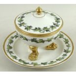 A KPM Berlin porcelain tureen, cover and stand, both painted with bands of trailing ivy, gilt rims,
