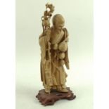 A Chinese fruitwood figural carving, mid to late 20th century, modelled as Shou Lao,