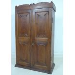A 19th century Welsh oak and mahogany cabinet, with shaped cornice,