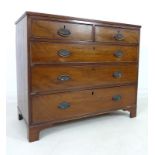 A George III mahogany chest of two short over three long graduating drawers,