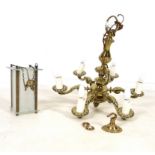 A 19th century five brass candelabra with scroll arms and an acorn terminal, 58cm high,