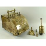 An Arts and Crafts brass coal scuttle, with lid secured with copper rivets, 27.