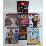 A collection of James Bond related ephemera, including copies of GQ, Esquire, Maxim,