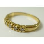 An 18ct gold five stone diamond ring, approx 0.16ct total diamond weight, size L, 2.