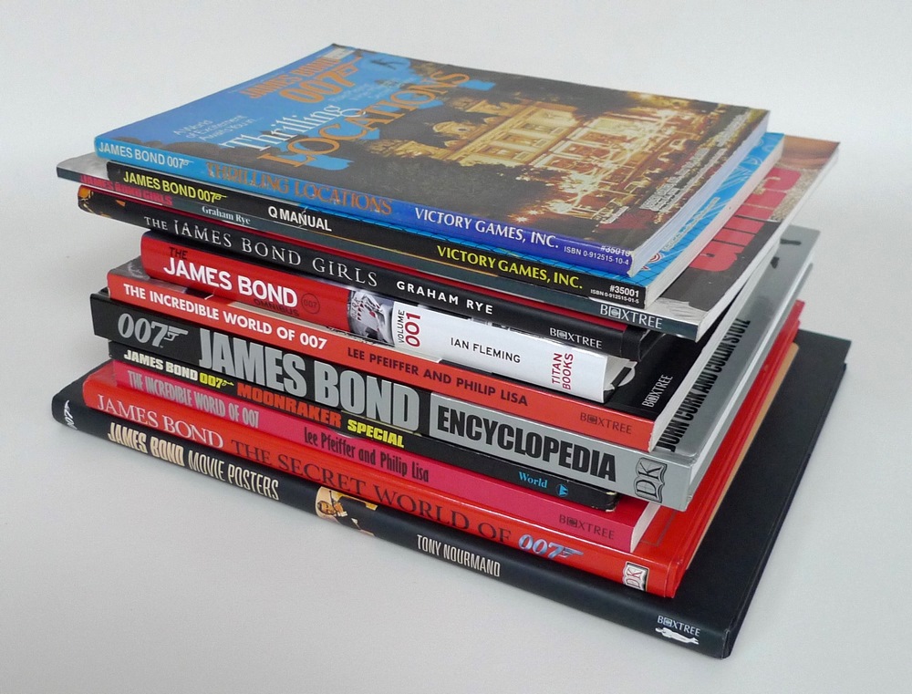 A group of James Bond coffee table books, including titles such as 'The James Bond Omnibus',