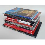 A group of James Bond coffee table books, including titles such as 'The James Bond Omnibus',