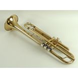 A Trevor Jones trumpet, 48cm, in fitted case, 22 by 14 by 54cm.