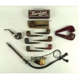 A collection of early to mid 20th century pipes including an unusual long stemmed German pipe,