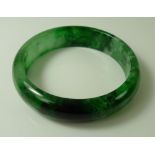 An apple and spinach jade bangle, modern, 7.2cm diameter, 53.7g.