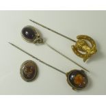 An Intaglio stick pin with fox's mask,