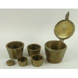 A set of 18th or early 19th century bronze merchant's scales nesting weights, by Youngs of London,