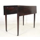 A 19th century mahogany Pembroke table, single drawer with cock beading and turned handles,