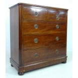 A Victorian mahogany chest of two over three graduating drawers, with brass ring handles,