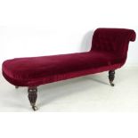 A late Victorian chaise longue, the red upholstered seat with single scroll button back arm,