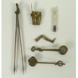 A small collection of Victorian collectables, comprising three pairs of skirt lifters, largest 22cm,