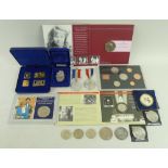 A group of coins and commemorative medals,