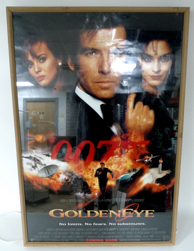 A James Bond promotional poster, 'Goldeneye', set in lightbox with MDF frame, 8 by 70 by 103.