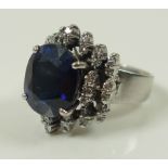 An 18ct white gold, diamond and sapphire dress ring,
