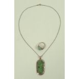 A 14ct gold and jade pendant,