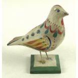 An early to mid 20th century Danish wooden model of a bird, brightly painted with red,