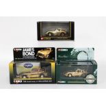 A group of three special edition gold plated die cast replica models, each an Aston Martin DB5,