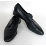 A pair of black leather shoes worn by Roger Moore,