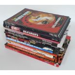 A collection of James Bond reference books and annuals, including 'The Secret World of 007',